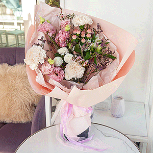 Carnation white, cream - 5, Newton White Spray Chrysanthemum - 1, Alstromeria white, soft pink - 1, Pink Lisianthus (Eustoma) - 2, Hypericum, Limonium (1 pc.), Waxflower (1 pc.), Wrapping Paper