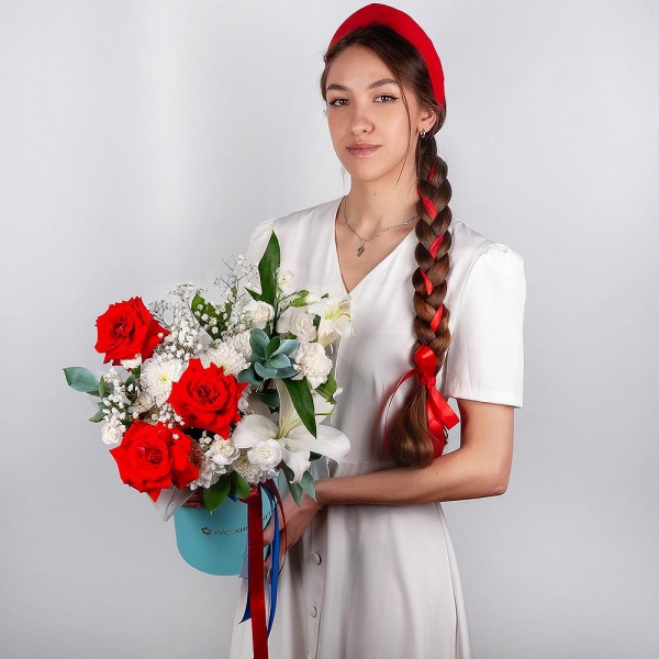 Red rose Nina 50 cm - 5, Gypsophila - 1, Baltica White Spray Chrysanthemum - 1, White spray carnation - 3, Carnation white, cream - 3, Lilies - 1, Round flower box medium, Oasis, Ruscus, Ribbon