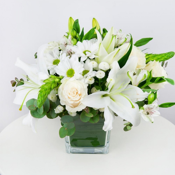 Lilies - 3, White rose 50 cm - 5, Bacardi White Spray Chrysanthemum - 3, Alstromeria white, soft pink - 3, Santini White Spray Chrysanthemum - 2, Transparent vase, Oasis, Ornithogalum, Eucalyptus Cinerea