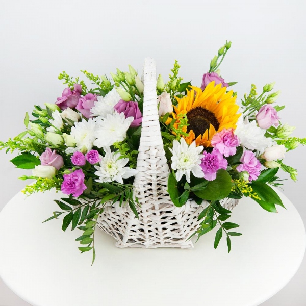 Sunflower - 1, Baltica White Spray Chrysanthemum - 4, Pink spray carnation - 4, Pink Lisianthus (Eustoma) - 2, Medium Basket, Oasis, Pistachio, Solidago (1 pc.)