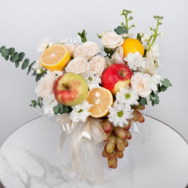 Bacardi White Spray Chrysanthemum - 2, Peony sprayrose - 2, White Matthiola - 3, Alstromeria white, soft pink - 3, Round flower box small , Oasis, Eucalyptus Cinerea, Lemon, 1 pc., Apple, 1 pc., Grapes, Wooden skewer, Ribbon