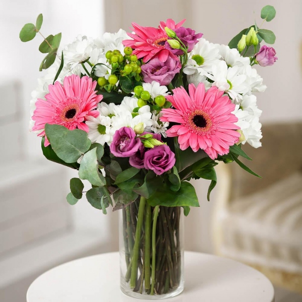 Gerbera pink - 4, Bacardi White Spray Chrysanthemum - 4, Purple Lisianthus (Eustoma) - 3, Hypericum, Eucalyptus Cinerea, Wrapping Paper