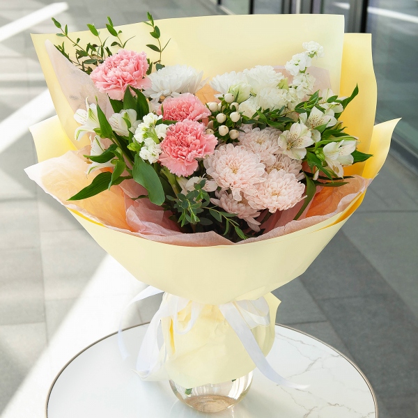 Pink carnation - 3, White Matthiola - 2, Baltica White Spray Chrysanthemum - 2, Alstromeria white, soft pink - 2, lisianthus - 1, Hypericum, Eucalyptus parvifolia (1 pc.), Wrapping Paper