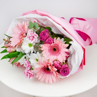 Gerbera daisies - 3, Bacardi White Spray Chrysanthemum - 1, Carnation spray - 2, Spray rose 50 cm (multiple small blooms on a stem) - 2, Alstromeria white, soft pink - 1, Eucalyptus Cinerea, Wrapping Paper, Ribbon