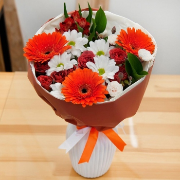 Gerbera daisies - 3, Bacardi White Spray Chrysanthemum - 1, Carnation spray - 2, Spray rose 50 cm (multiple small blooms on a stem) - 2, Alstromeria white, soft pink - 1, Eucalyptus Cinerea, Wrapping Paper, Ribbon
