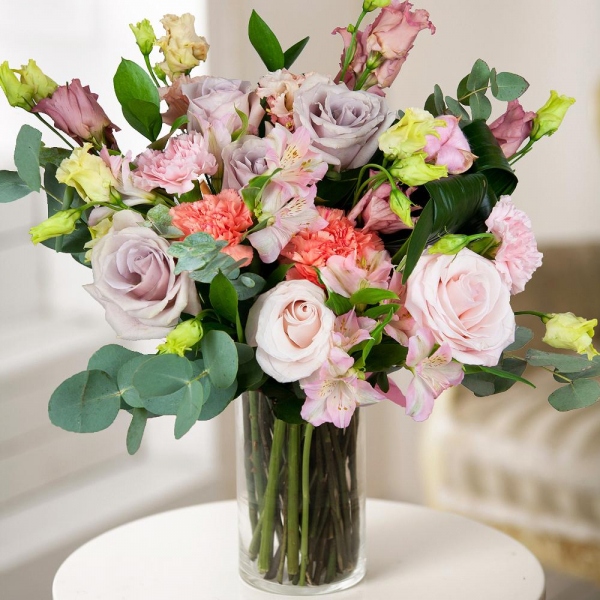 Orange carnation - 3, Pink rose 50 cm - 9, Alstromeria white, soft pink - 3, Pink Lisianthus (Eustoma) - 5, Pink carnation - 4, Ruscus, Aspidistra (1 pc.), Eucalyptus Cinerea, Wrapping Paper