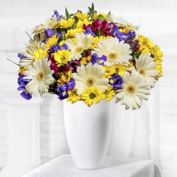 Irises - 15, Bacardi Yellow Spray Chrysanthemum - 9, Alstromeria lilac, purple - 9, Gerbera white - 13, Salal, Wrapping Paper, Ribbon