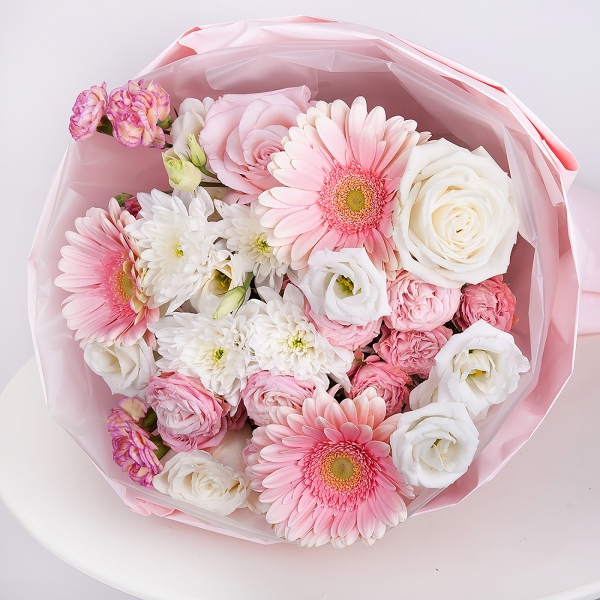 Gerbera pink - 3, Pink rose 50 cm - 3, White rose 50 cm - 2, Baltica White Spray Chrysanthemum - 1, Peony sprayrose - 2, Pink spray carnation - 2, lisianthus - 2, Wrapping Paper