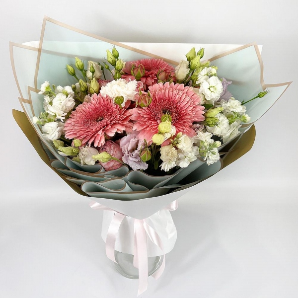 Gerbera pink - 3, White Matthiola - 2, Carnation white, cream - 3, lisianthus - 3, Peony sprayrose - 3, Wrapping Paper, Ribbon
