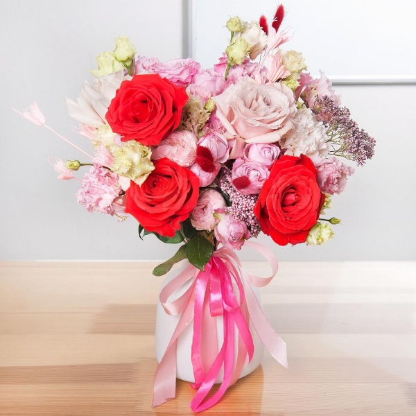Red rose Nina 50 cm - 3, Pink rose 50 cm - 4, Rose Powder 50 cm Ecuador (Quicksand, Menta) - 2, Carnation white, cream - 4, Bright pink spray rose mix, 50 cm - 1, Peony sprayrose - 2, Pink Lisianthus (Eustoma) - 2, Ozotamnus, Dried flowers in assortment, Ribbon