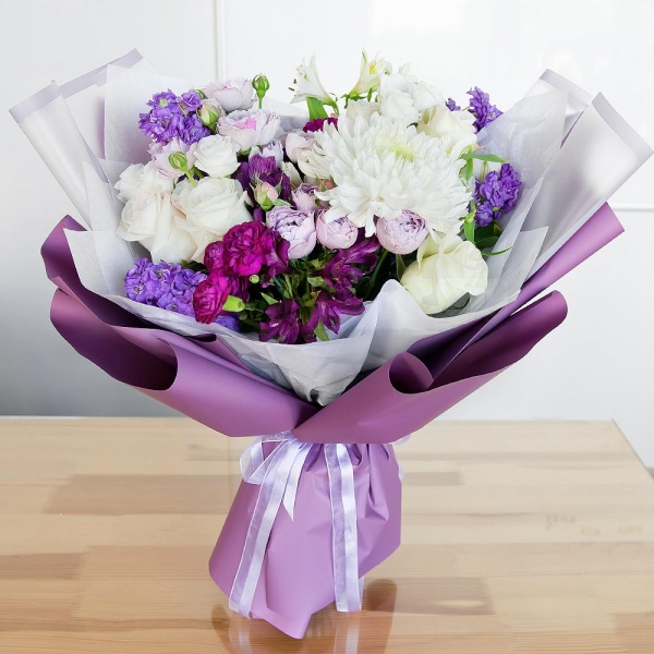 White rose 50 cm - 7, Spray peony rose Lavander, 50 cm - 3, lisianthus - 3, Alstromeria lilac, purple - 3, Carnation spray - 3, Magnum White Chrysanthemum - 1, Matthiola Lilac - 4, Alstromeria white, soft pink - 3, Wrapping Paper