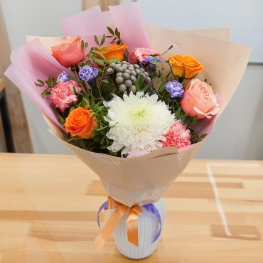 Magnum White Chrysanthemum - 1, Carnations - 3, Peony rose Kahala 50 cm - 2, Multicolor rose 50 cm - 3, Brunia Green Lanuginosa (1 pc.), Pistachio, Wrapping Paper, Ribbon, Pink spray carnation
