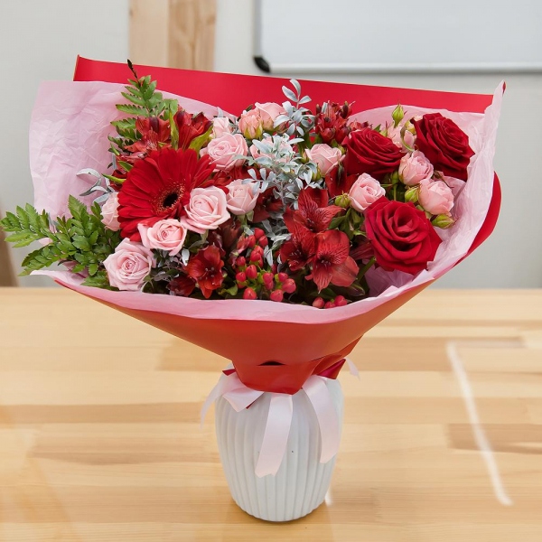 Gerbera red - 1, Red rose 50 cm - 5, Bright pink spray rose mix, 50 cm - 4, Alstromeria Red, Bright Pink - 7, Hypericum, Pistachio, Fern (1 pc.), Wrapping Paper, Ribbon