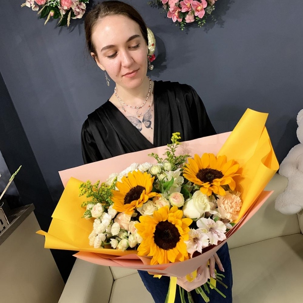 Sunflower - 3, Carnation white, cream - 7, Santini White Spray Chrysanthemum - 4, Alstromeria white, soft pink - 6, Peony sprayrose - 4, White rose 50 cm - 5, Solidago (1 pc.), Wrapping Paper, Ribbon