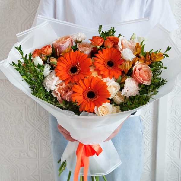Gerbera daisies - 3, Pink-orange rose Phoenix 50 cm - 9, Alstromeria Yellow, Orange - 6, Spray rose: yellow, orange 50 cm - 2, lisianthus - 1, Carnation white, cream - 10, Spray rose: white, cream, light pink 50 cm - 3, Pistachio, Wrapping Paper