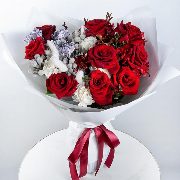 Red rose 50 cm - 12, Alstromeria Red, Bright Pink - 8, Carnation white, cream - 3, Carnation white, cream - 9, Pistachio, Dried flowers in assortment, Solidago (1 pc.), Wrapping Paper, Brunia Green Lanuginosa (1 pc.)