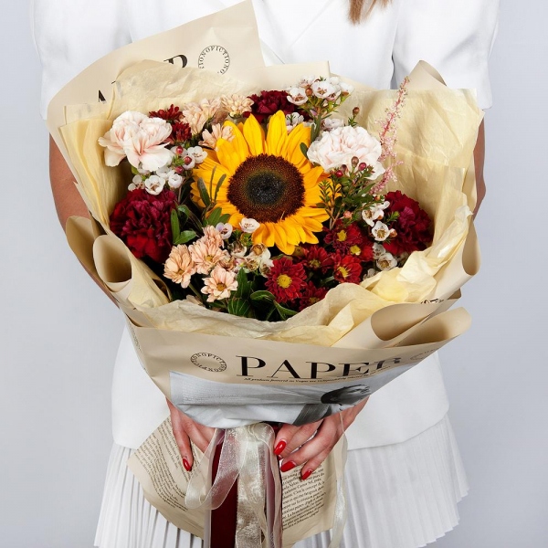 Sunflower - 1, Daisy poms Santini pink, purple - 5, Carnation red - 4, Carnation white, cream - 3, Waxflower (1 pc.), Astilbe, Pistachio, Wrapping Paper
