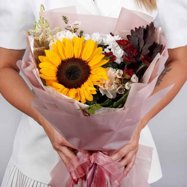 Sunflower - 1, Pink carnation - 5, Bacardi White Spray Chrysanthemum - 2, Bacardi Red Spray Chrysanthemum - 1, Astilbe, Waxflower (1 pc.), Pistachio, Salal, Wrapping Paper