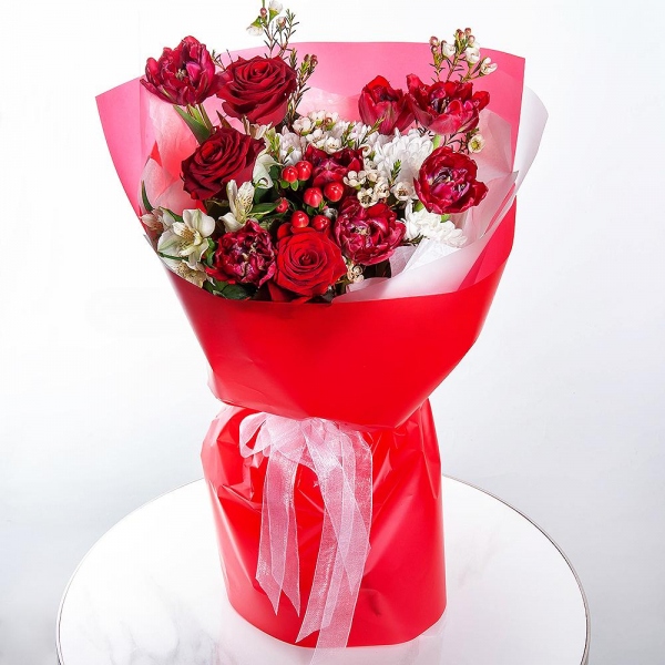 Baltica White Spray Chrysanthemum - 1, Red rose 50 cm - 3, Red tulip - 13, Alstromeria white, soft pink - 3, Hypericum, Waxflower (1 pc.), Wrapping Paper
