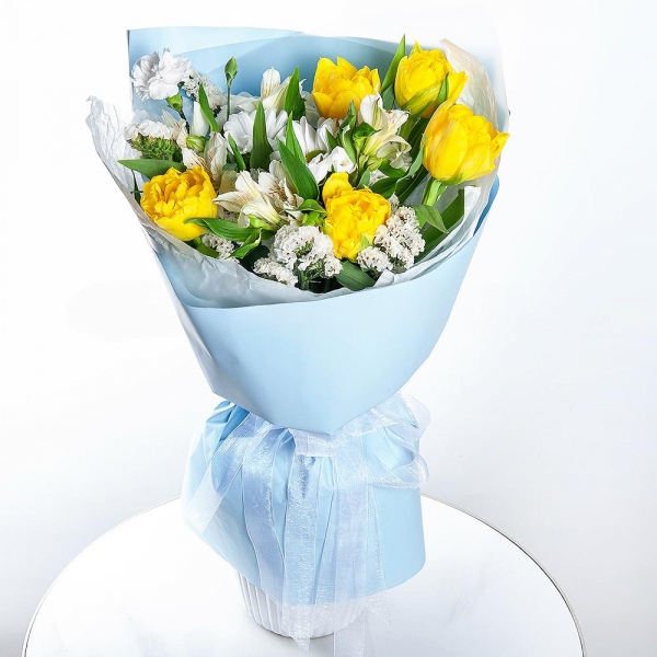 Yellow tulip - 9, Bacardi White Spray Chrysanthemum - 1, Alstromeria white, soft pink - 2, White spray carnation - 2, White statice, Wrapping Paper